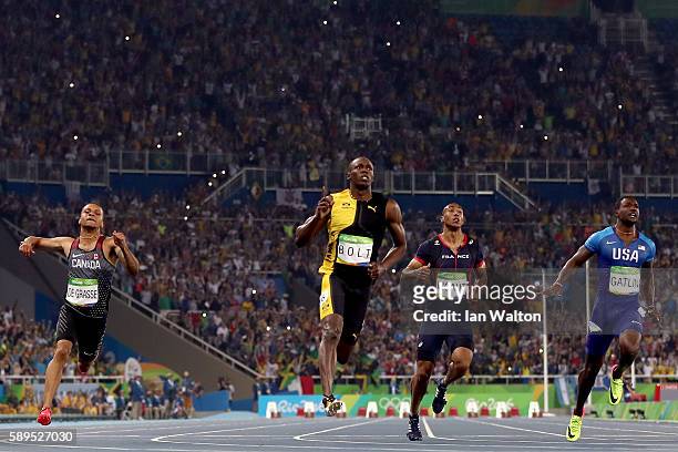 Usain Bolt of Jamaica wins the Men's 100m Final ahead of Andre De Grasse of Canada and Justin Gatlin of the United States on Day 9 of the Rio 2016...