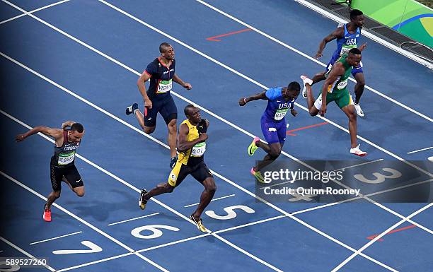 Usain Bolt of Jamaica wins the Men's 100 meter final ahead of Justin Gatlin of the United States and Andre De Grasse of Canada on Day 9 of the Rio...