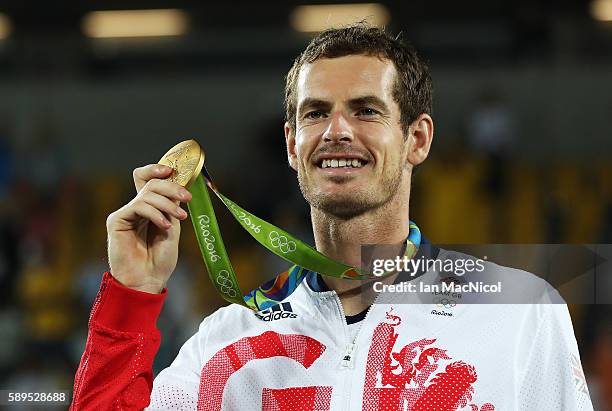Andy Murray of Great Britain poses with his Gold medal after defeating Juan Martin del Potro of Argentina in the Men's singles final at Olympic...
