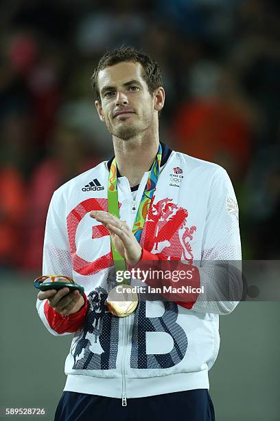 Andy Murray of Great Britain poses with his Gold medal after defeating Juan Martin del Potro of Argentina in the Men's singles final at Olympic...