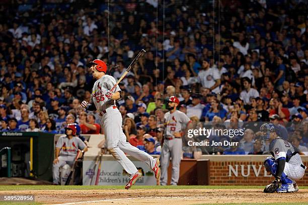 Stephen Piscotty of the St. Louis Cardinals celebrates after hitting a three run home run against the Chicago Cubs during the eighth inning at...