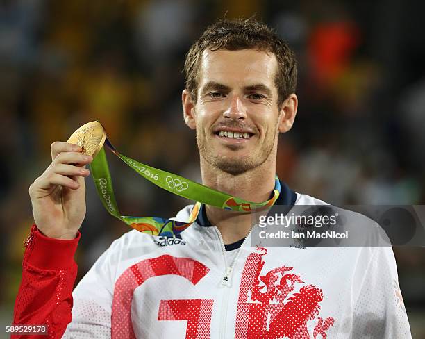 Andy Murray of Great Britain poses with his Gold medal after defeating Juan Martin del Potro of Argentina in the Men's singles final at Olympic...