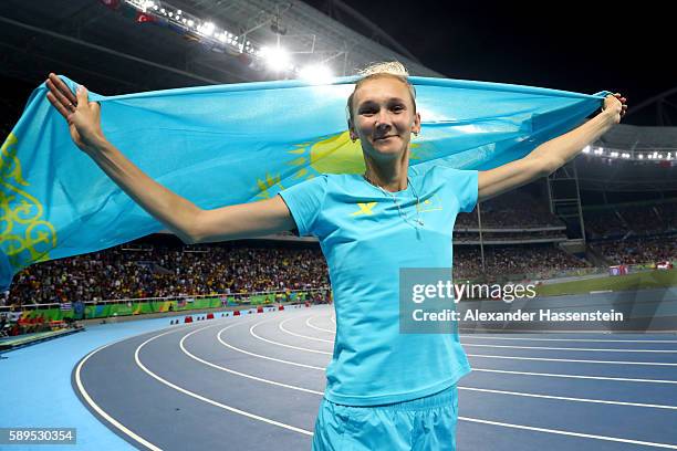 Olga Rypakova of Kazakhstan celebrates winning bronze in the Women's Triple Jump final on Day 9 of the Rio 2016 Olympic Games at the Olympic Stadium...