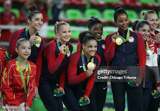 The U.S. Team celebrates their gold medal in the women's gymnastics team final on Aug. 9, 2016.