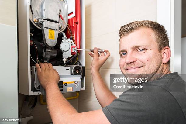 furnace heating maintenance and repair - windrad energie stockfoto's en -beelden