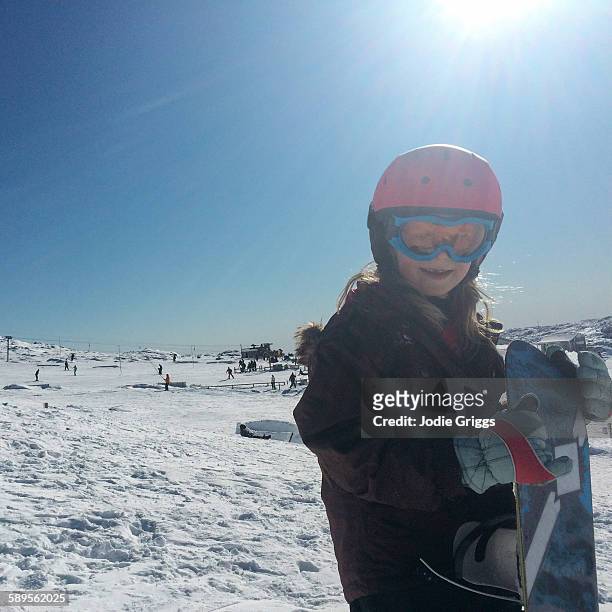 happy young girl at the snow with a snowboard - snowboard day 6 foto e immagini stock
