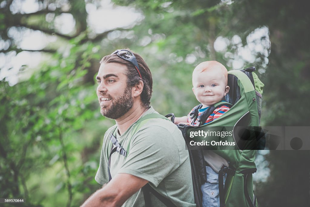 Father Backpacking Hiking with Baby in Forest