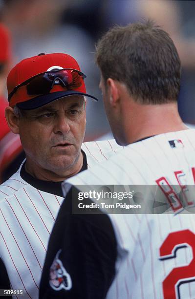 Manager Bob Boone of the Cincinnati Reds talks with Rob Bell during the game against the Arizona Diamondbacks at Cinergy Field in Cincinnati, Ohio....