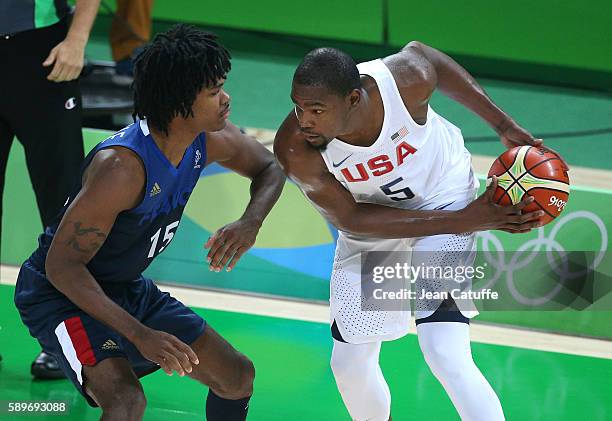 Mickael Gelabale of France and Kevin Durant of USA in action during the basketball match between France and USA at Carioca Arena 1 on August 14, 2016...