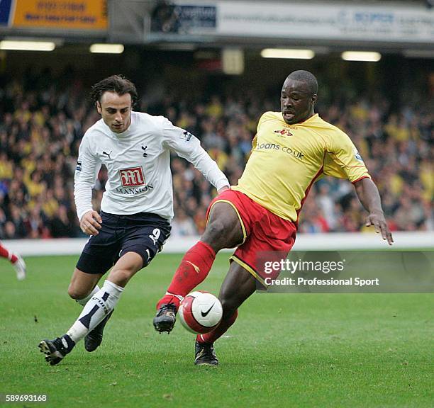 Dimitar Berbatov of Tottenham Hotspur tussles with Danny Shittu of Watford during the Barclays Premiership match between Watford and Tottenham...