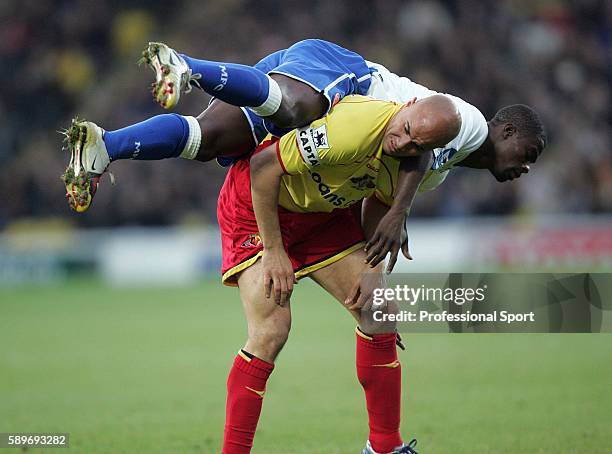 Gavin Mahon of Watford ends up with George Boateng of Middlesbrough on his back during the Barclays Premiership match between Watford and...