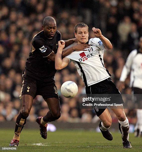 Anthony Gardner of Tottenham Hotspur gets to grips with Heidar Helguson of Fulham during the FA Cup sponsored by EON 5th Round match between Fulham...