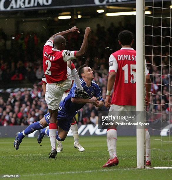 Abou Diaby of Arsenal accidentally kicks John Terry of Chelsea in the face during the Carling Cup Final match between Chelsea and Arsenal at the...