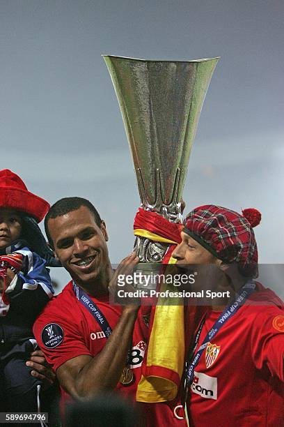 Luis Faviano and Adriano Correia of Sevilla celebrate with the cup at the end of the UEFA Cup Final between Espanyol and Sevilla at Hampden Park on...