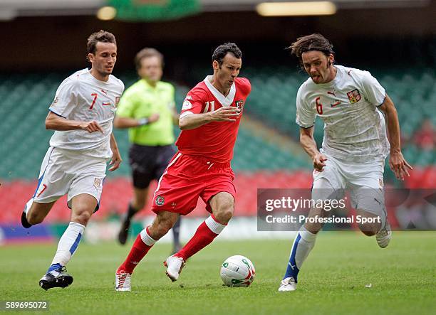 Wales captain Ryan Giggs goes past Marek Jankulovski and Tomas Sivok of the Czech Republic during the Euro 2008 Group D Qualifying Match between...