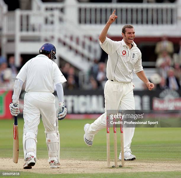 Chris Tremlett of England celebrates getting the wicket of Rahul Dravid of India during day four of the 1st Test Match between England and India at...