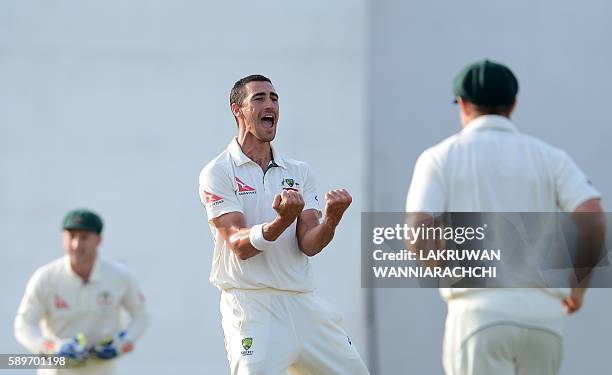 Australia's Mitchell Starc celebrates after he dismissed Sri Lanka's Dilruwan Perera during the third day of the third and final Test cricket match...