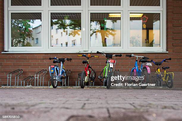 Colorful bicycles for children are captured in front of a kindergarten on August 04, 2016 in Berlin, Germany.