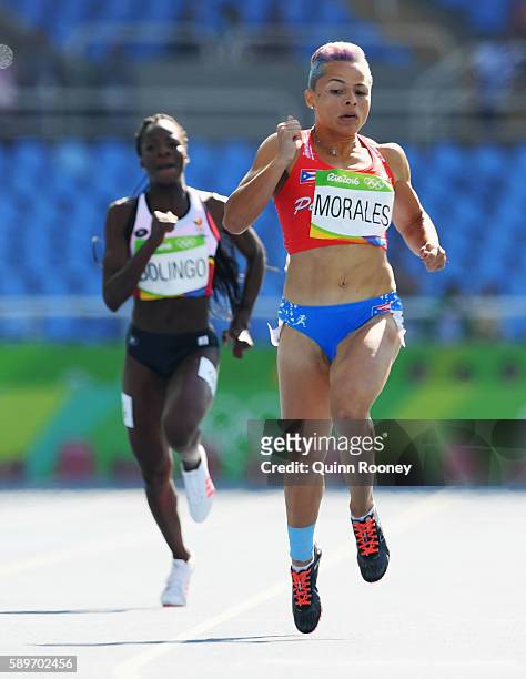 Celiangeli Morales of Puerto Rico and Cynthia Bolingo of Belgium compete in round one of the Women's 200m on Day 10 of the Rio 2016 Olympic Games at...