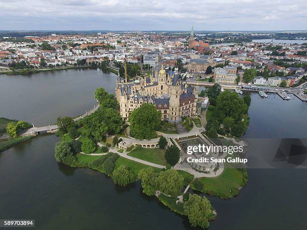 In this aerial view Schloss Schwerin castle, seat of the state parliament of the state of Mecklenburg-Western Pomerania and also a UNESCO Wolrd...