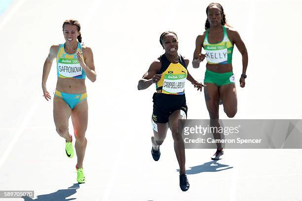 Olga Safronova of Kazakhstan, Veronica Campbell-Brown of Jamaica and Ashley Kelly of Virgin Islands, British compete in round one of the Women's 200m...