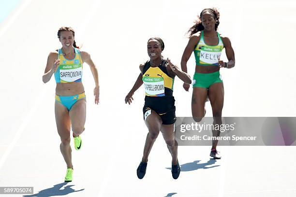 Olga Safronova of Kazakhstan, Veronica Campbell-Brown of Jamaica and Ashley Kelly of Virgin Islands, British compete in round one of the Women's 200m...