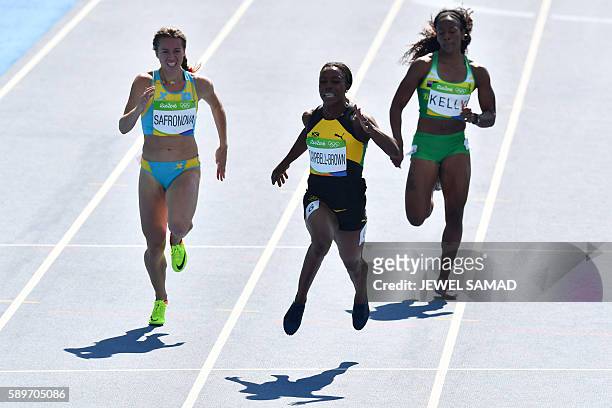 Kazakhstan's Olga Safronova, Jamaica's Veronica Campbell-Brown and British Virgin Islands's Ashley Kelly compete in the Women's 200m Round 1 during...