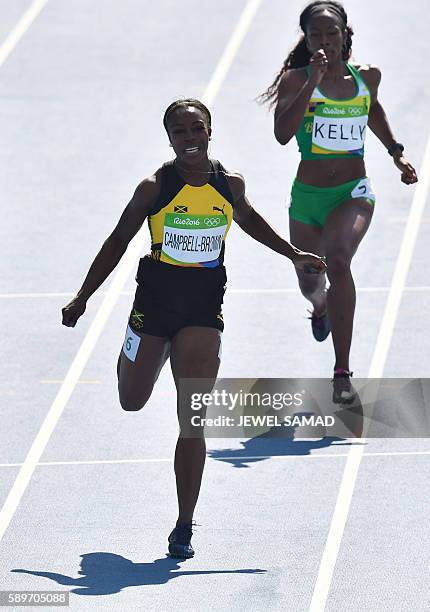 Jamaica's Veronica Campbell-Brown and British Virgin Islands's Ashley Kelly compete in the Women's 200m Round 1 during the athletics event at the Rio...