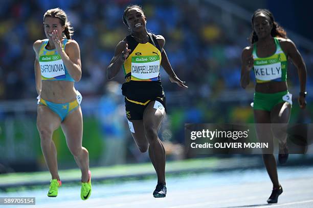 Jamaica's Veronica Campbell-Brown competes with Kazakhstan's Olga Safronova and British Virgin Islands's Ashley Kelly in the Women's 200m Round 1...