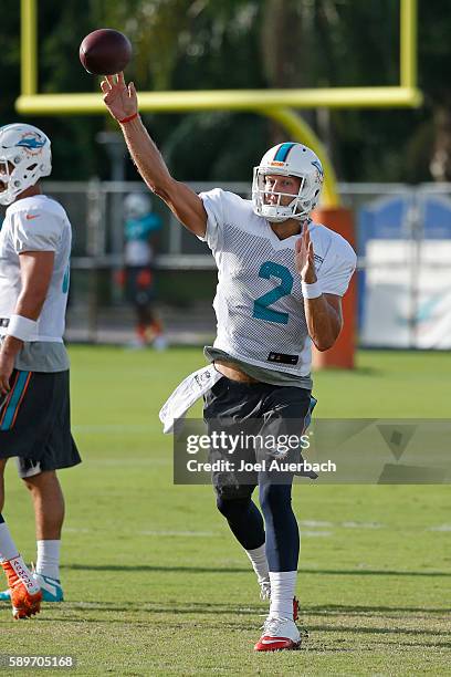 Zac Dysert of the Miami Dolphins throws the ball during the teams training camp at the Miami Dolphins training facility on August 15, 2016 in Davie,...