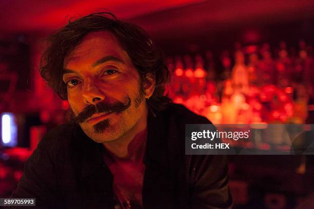 portrait of a bartender at a nightclub - barman stock pictures, royalty-free photos & images