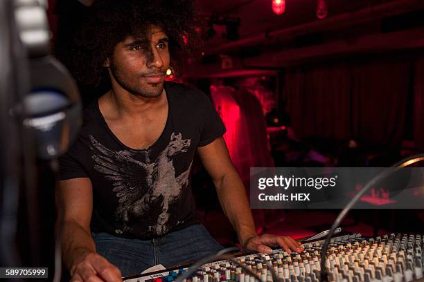 young man djing at a night club - djiang stock pictures, royalty-free photos & images