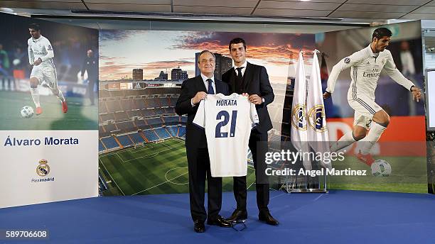 Alvaro Morata of Real Madrid poses with president Florentino Perez during his official presentation at Estadio Santiago Bernabeu on August 15, 2016...