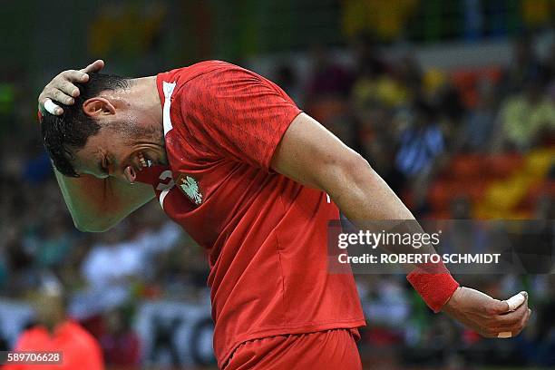 Poland's right back Krzysztof Lijewski reacts during the men's preliminaries Group B handball match Poland vs Slovenia for the Rio 2016 Olympics...