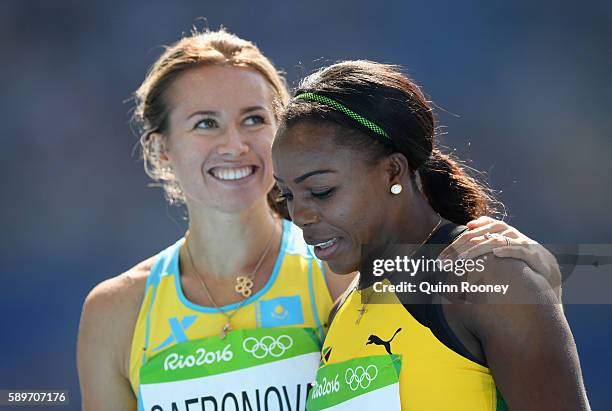 Olga Safronova of Kazakhstan and Veronica Campbell-Brown of Jamaica react after round one of the Women's 200m on Day 10 of the Rio 2016 Olympic Games...