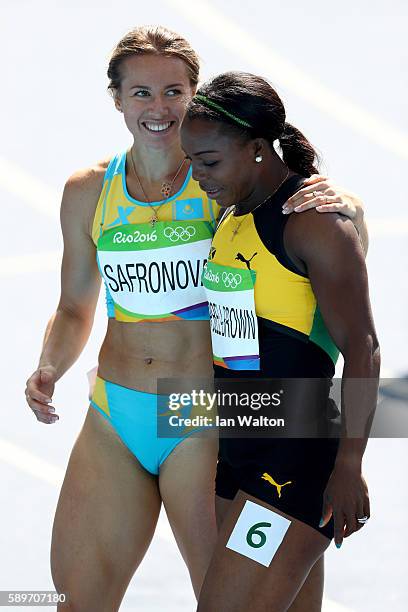 Olga Safronova of Kazakhstan and Veronica Campbell-Brown of Jamaica react after round one of the Women's 200m on Day 10 of the Rio 2016 Olympic Games...