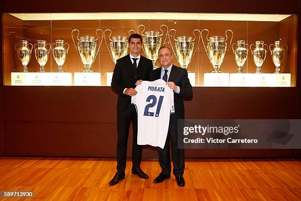 Alvaro Morata of Real Madrid poses with Real Madrid president Florentino Perez during his official presentation at Estadio Santiago Bernabeu on...