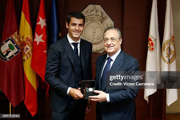 Alvaro Morata of Real Madrid poses with Real Madrid president Florentino Perez during his official presentation at Estadio Santiago Bernabeu on...