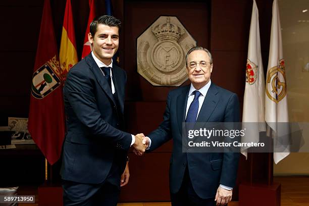 Alvaro Morata of Real Madrid shakes hands with Real Madrid president Florentino Perez during his official presentation at Estadio Santiago Bernabeu...