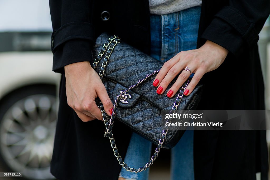 Maxilie Mlinarskij wearing a black Chanel bag and red nail polish on  News Photo - Getty Images
