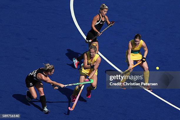 Anita Mclaren of New Zealand shoots the ball past Madonna Blyth of Australia during the quarter final hockey game on Day 10 of the Rio 2016 Olympic...
