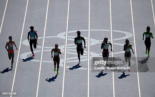 Ivet Lalova-Collio of Bulgaria lead Ella Nelson of Australia, Jodie Williams of Great Britain and the rest of the field to the finish in heat seven...