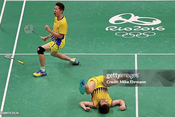 Shem Goh and Wee Kiong Tan of Malaysia celebrate winning a Mens Doubles Quarterfinal match against Yong Dae Lee and Yeon Seong Yoo of Korea on Day 10...