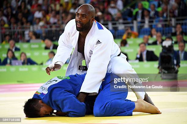 Teddy Riner of France and Hisayoshi Harasawa of Japan competes during judo final on Olympic Games 2016 in Rio at Carioca Arena 2 on August 12, 2016...