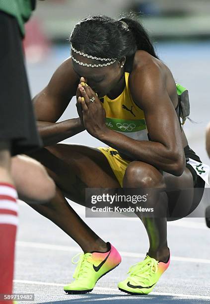 Jamaican sprinter Elaine Thompson puts her hands together after winning the women's 100-meter final at the Rio de Janeiro Olympics on Aug. 13, 2016.