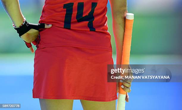The USA's Katie Reinprecht waits for playing on the sidelines during the women's quarterfinal field hockey USA vs Germany match of the Rio 2016...
