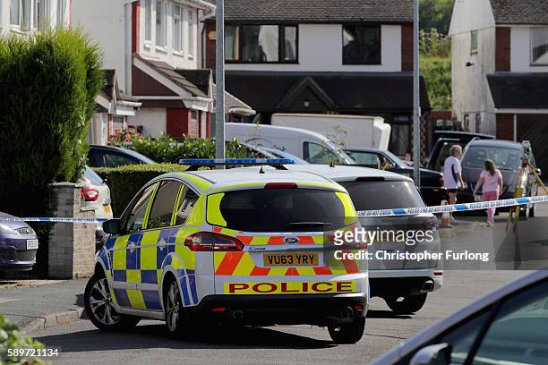 Police officers work in Meadow Way, Trench, Telford at the scene where former Aston Villa player Dalian Atkinson was tasered by police on August 15,...