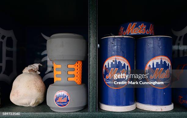 Detailed view of New York Mets baseball bat weights and rosin bag sitting in the dugout prior to the game against the Detroit Tigers at Comerica Park...