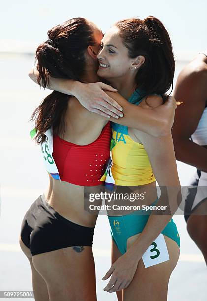 Ella Nelson of Australia and Ivet Lalova-Collio of Bulgaria embrace after the Women's 200 metres heats on Day 10 of the Rio 2016 Olympic Games at the...