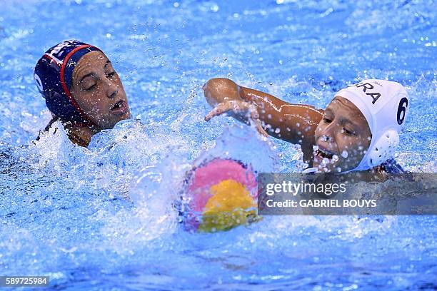 Kaleigh Gilchrist vies with Brazil's Izabella Chiappini during their Rio 2016 Olympic Games waterpolo quaterfinal match at the Olympic Aquatics...